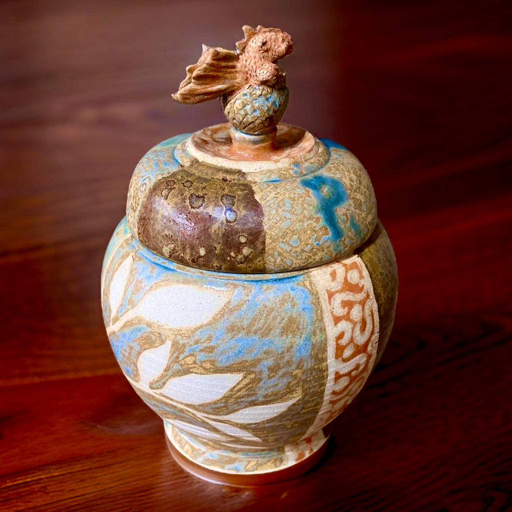 A Jar, with a baby dragon