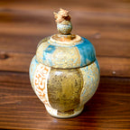 A Jar, with a baby dragon