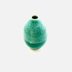 A bright green small vase