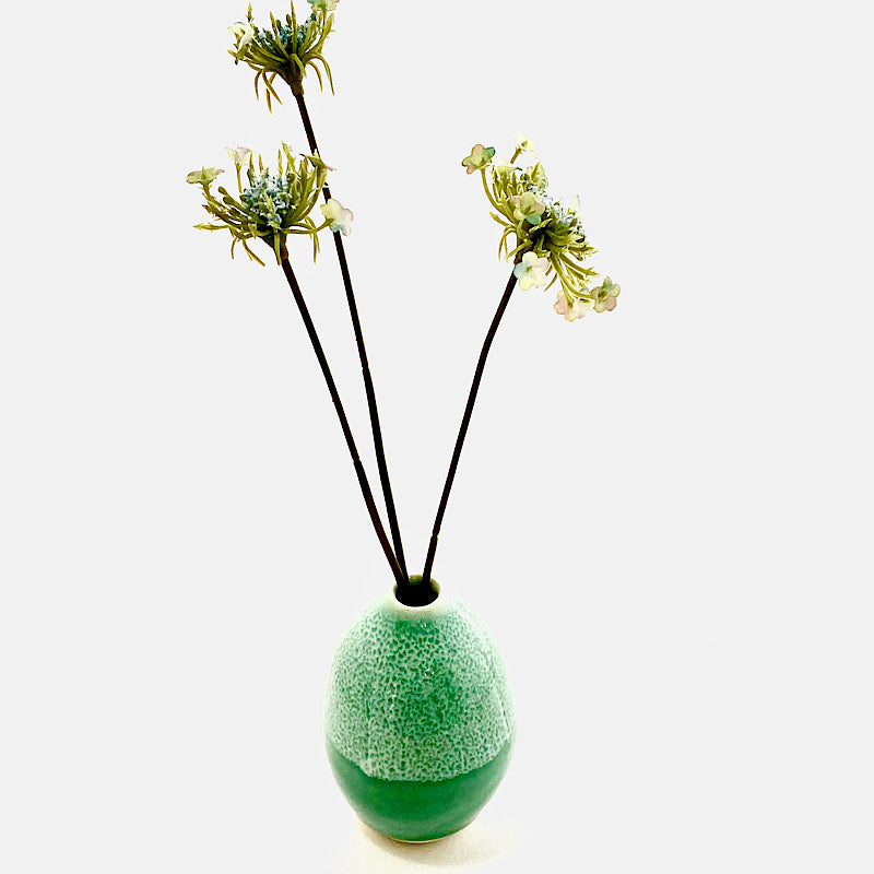 A bright green small vase