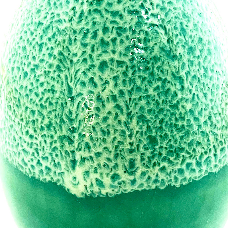 A bright green small vase