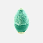 A bright green small vase